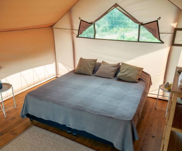 Interior of bedroom inside glamping house