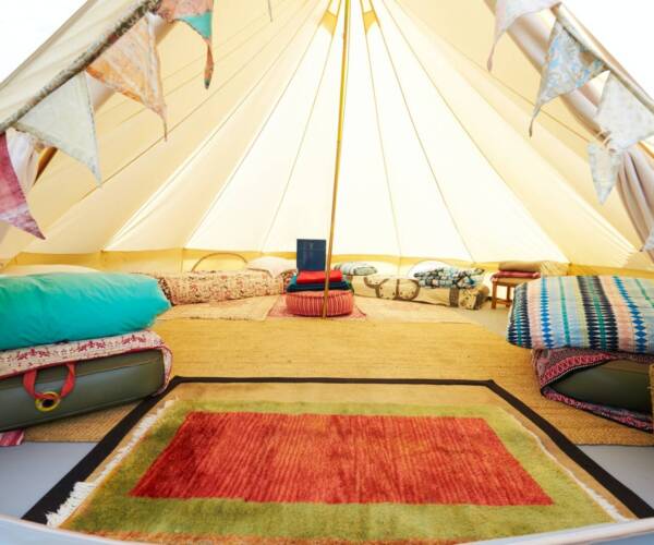 Interior View Of Teepee Tent Pitched On Glamping Camp Site With No People